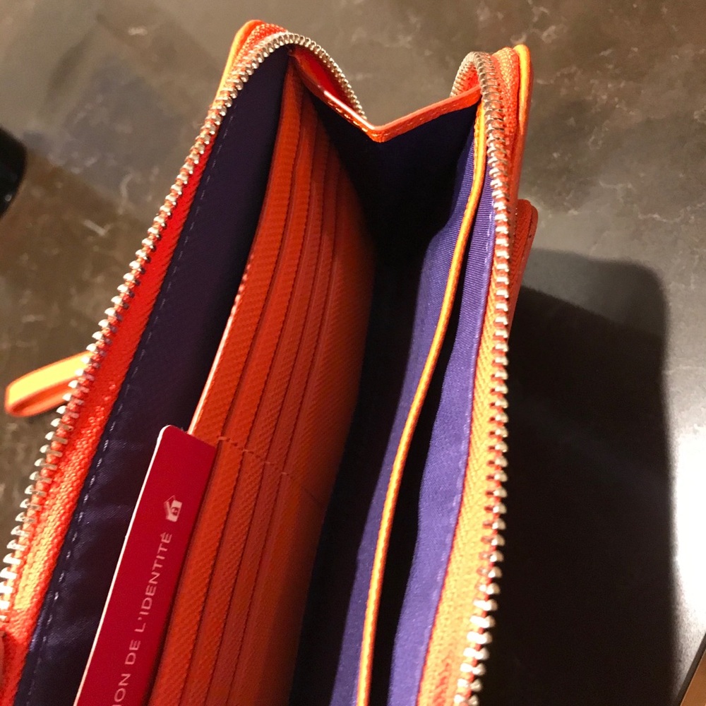 Orange tumi wallet